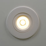 WHITE 4" slim LED gimbal downlight with selectable CCT for sleek, adjustable directional lighting.